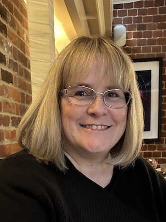 June Reid, professional counsellor at June Reid Counselling, smiling in a welcoming and relaxed setting